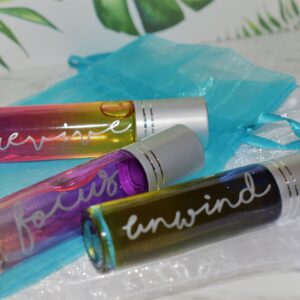Three rollerball bottles of "revive, focus and unwind"